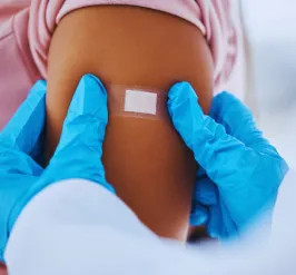 Person with band aid on arm 